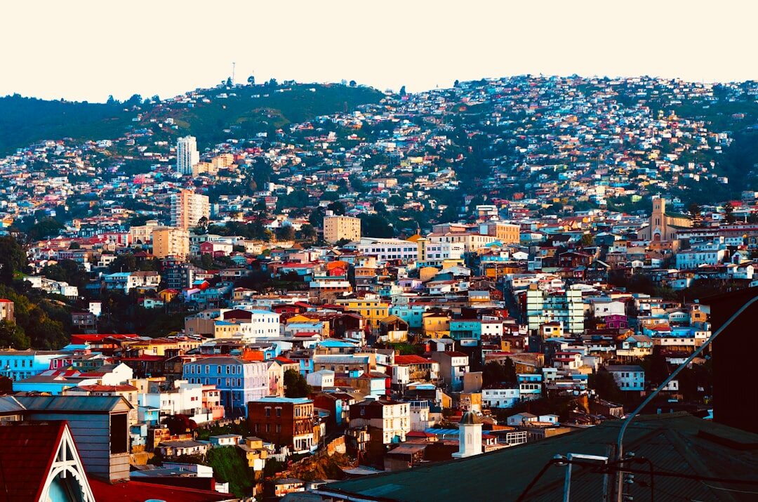 Aerial view of colorful hillside houses in Valparaiso, Chile at sunset